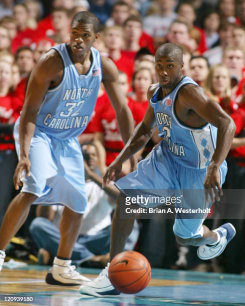 Rashad McCants and Raymond Felton pursue a loose ball during the second half of the Tar Heels 91-68 victory over the Davdison Wildcats.