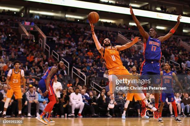 Ricky Rubio of the Phoenix Suns attempts a shot ahead of Tony Snell of the Detroit Pistons during the second half of the NBA game at Talking Stick...