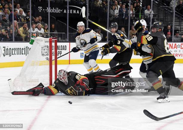 Robin Lehner of the Vegas Golden Knights makes a diving save against the Buffalo Sabres in the third period of their game at T-Mobile Arena on...