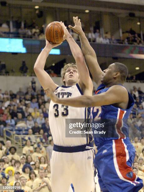 Pittsburgh Panthers Aaron Gray shoots over DePaul's Lorenzon Thompson during action at the Petersen Events Center on January 12, 2006 in Pittsburgh,...