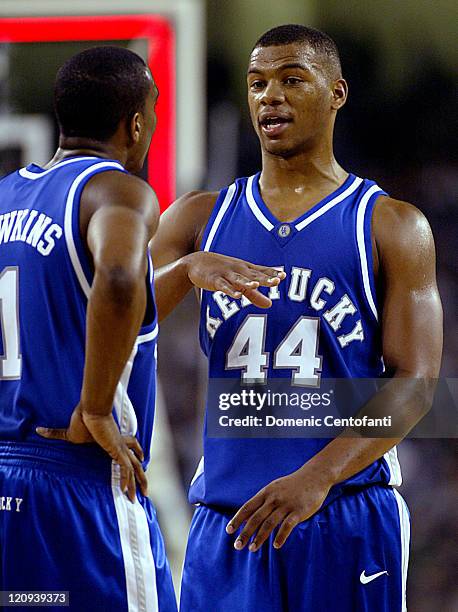 Kentucky's Chuck Hayes talks with Cliff Hawkins. Kentucky moved to No. 1 by beating the now 21-ranked Spartans of Michigan State 79-74 in front of a...