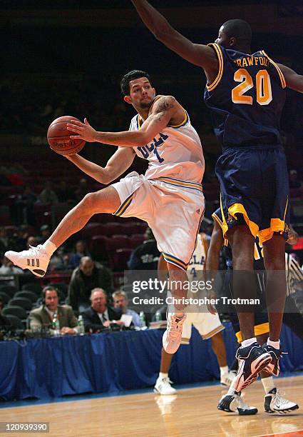 Jordan Farmar of the UCLA Bruins shoots around Crawford of the Drexel University Dragons in the consolation game of the NIT Tip Off at Madison Square...