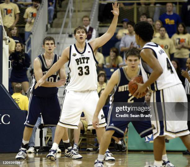 Pittsburgh Panthers' Aaron Gray signals for the ball while being guarded by Notre Dame's Luke Zeller during action at the Petersen Events Center on...