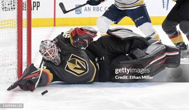 Robin Lehner of the Vegas Golden Knights makes a diving save against the Buffalo Sabres in the third period of their game at T-Mobile Arena on...