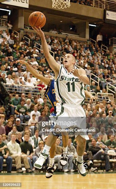 Michigan State's Drew Neitzel lays the ball in during the first half. Ninth-ranked Michigan State beat Coppin State 78-54 on Saturday, December 31,...