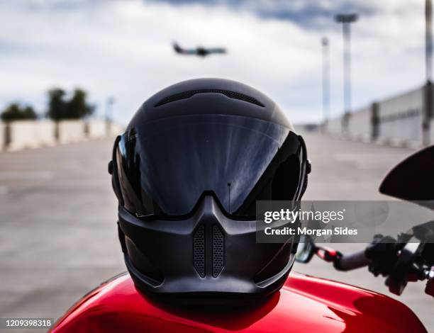 motorcycle helmet up close on motorcycle - helmet visor stock pictures, royalty-free photos & images