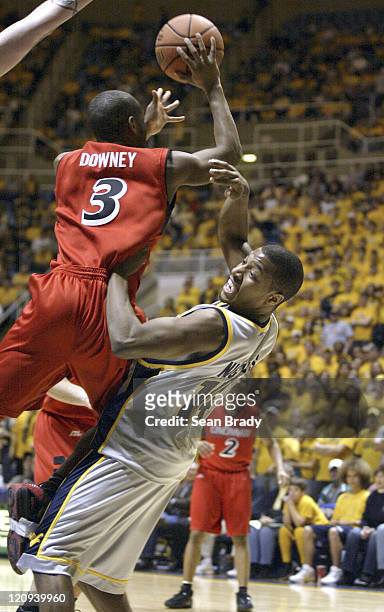 West Virginia's Darris Nichols is called for the foul against Cincinnati's Devan Diwney during action at the WVU Coliseum on February 4, 2006 in...