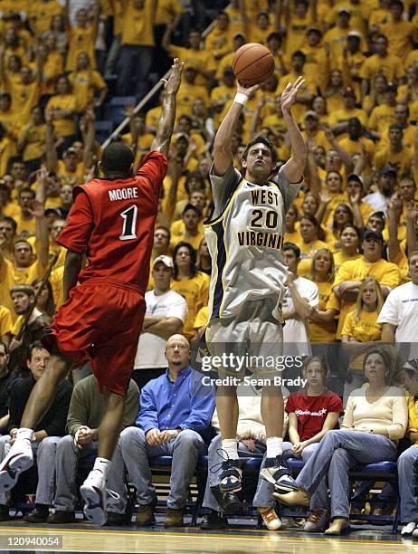 West Virginia's Mike Gansey puts up 3 points during action against Cincinnati at the WVU Coliseum on February 4, 2006 in Morgantown, West Virginia.