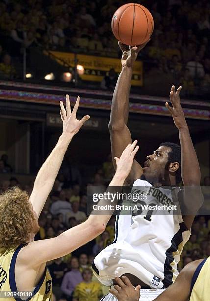 Wake Forest forward Eric Williams rises up to shoot over Georgia Tech center Luke Schenscher during first half action at the LJVM Coliseum in...