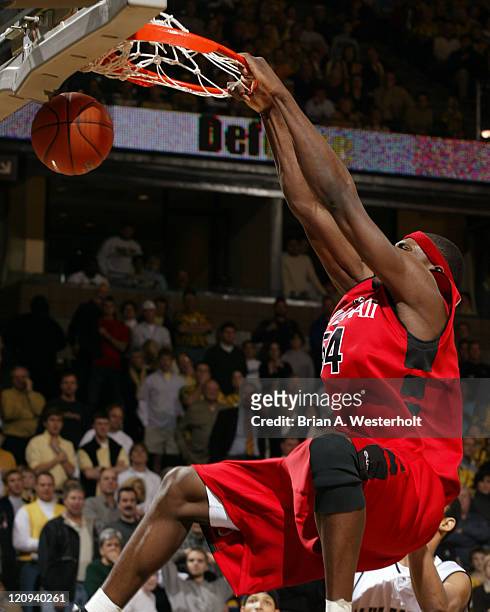 Jason Maxiell throws down a monster 2-hand jam late in the second half of Cincinnati's 91-85 loss to Wake Forest, February 15, 2004.
