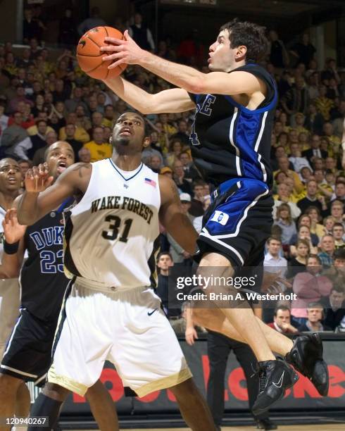 Duke guard J.J. Redick drives to the basket for 2 of his game high 33 points late in the second half versus Wake Forest at the LJVM Coliseum in...