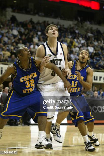 Pittsburgh Panthers Aaron Gray battles for position against Coppin States Darryl Proctor and West Otis during action at the Petersen Events Center on...