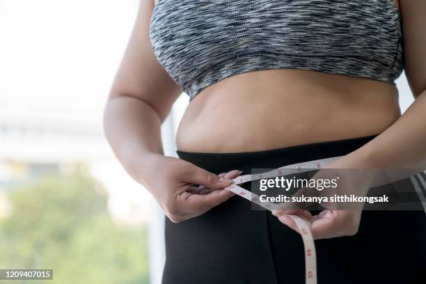 how do i get rid of this? - dieting women human abdomen stock pictures, royalty-free photos & images