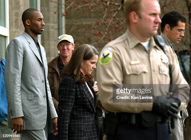 Kobe Bryant leaves the Eagle County Courthouse with his laywer Pamela Mackey, past Eagle County Sheriffs, following his first appearance in District...