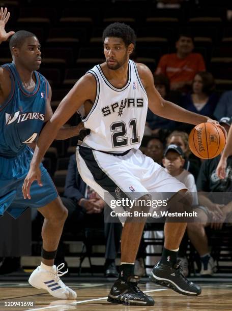 San Antonio center Tim Duncan backs down Washington Wizards forward Antawn Jamison during first quarter action at the LJVM Coliseum in Winston-Salem,...