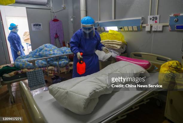 Medical worker disinfects a ward at the Huoshenshan makeshift hospital on February 22, 2020 in Wuhan, Hubei Province of China.