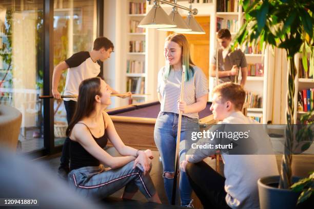 teenage friends playing pool - youth club stock pictures, royalty-free photos & images