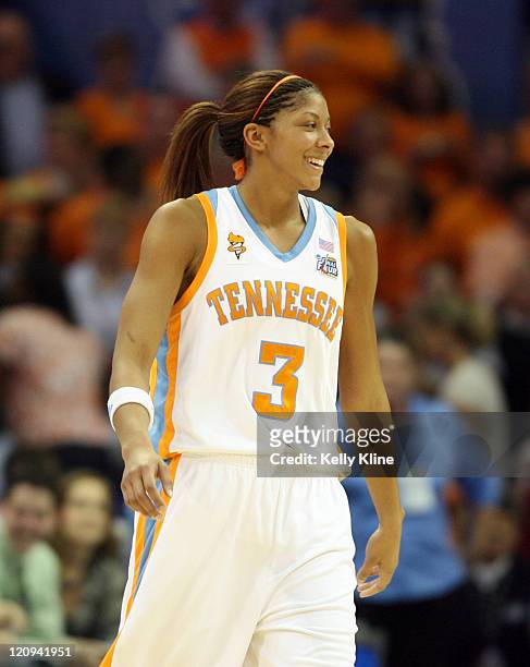 Candace Parker finally breaks a smile in the final minute during the NCAA Women's Basketball National Championship at Quicken Loans Arena in...