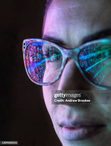 electronic circuit board on computer monitor reflecting in glasses of a female engineer. - business complexity stock pictures, royalty-free photos & images