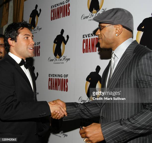 Oscar De La Hoya and LL Cool J during Oscar De La Hoya Hosts 7th Annual Evening of Champions at The Regent Beverly Wilshire Hotel in Beverly Hills,...