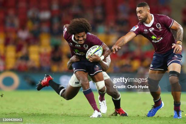 Henry Speight of the Reds makes a break during the round five Super Rugby match between the Reds and the Sharks at Suncorp Stadium on February 29,...