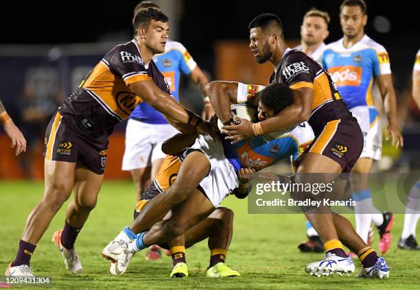 Kalium Watkins of the Titans takes on the defence during the NRL Trial match between the Brisbane Broncos and the Gold Coast Titans at Redcliffe on...