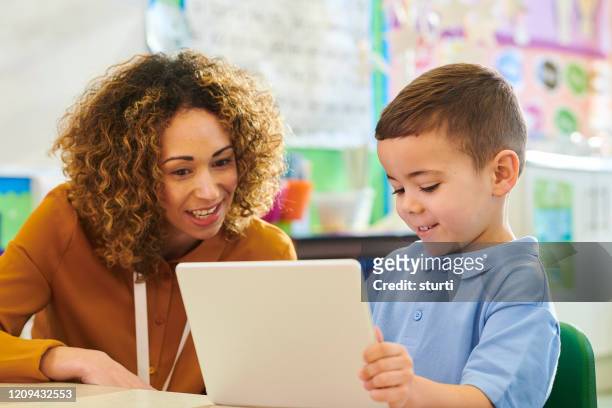 digital tablet learning - teacher stock pictures, royalty-free photos & images