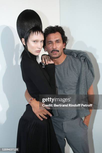 Bella Hadid and Designer Haider Ackermann pose after the Haider Ackermann show as part of the Paris Fashion Week Womenswear Fall/Winter 2020/2021 on...