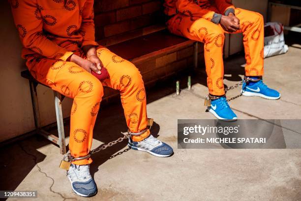 Inmates are seen sitting at the male section of the Johannesburg Correctional Centre also known as Sun City Prison, South Africa, on April 8, 2020.