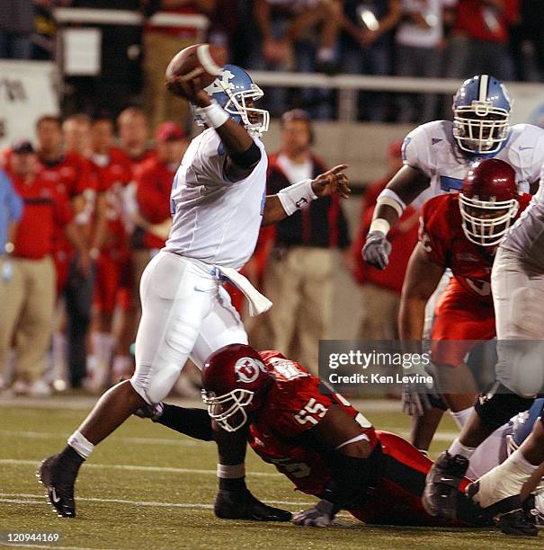 Carolina quarterback Darian Durant gets off a pass while being pressured by Utahs Andrew Johnson during the first quarter Saturday, Oct. 16, 2004 at...