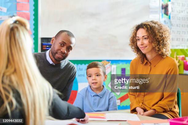 parent teacher meeting - parent stock pictures, royalty-free photos & images