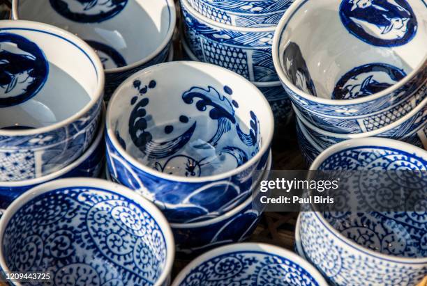 traditional japanese blue ceramic plates in takayama, japan - craft market stock pictures, royalty-free photos & images