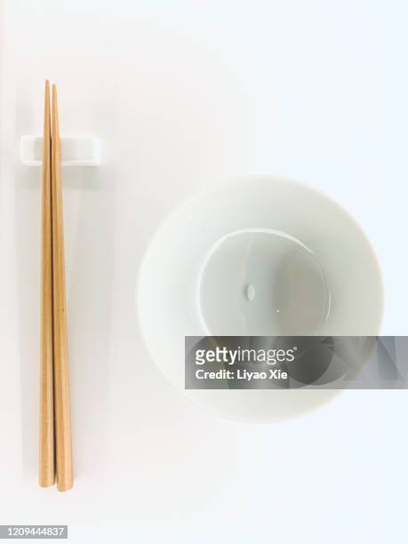 a grain rice with chopsticks - chopsticks stock pictures, royalty-free photos & images