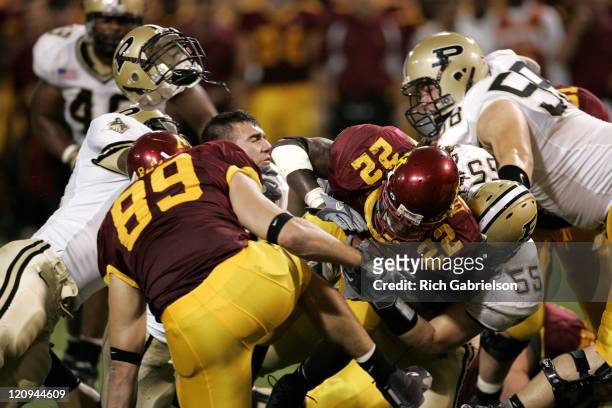 Helmets fly as Laurence Maroney dives for extra yards. The Minnesota Golden Gophers defeated the Purdue Boilermakers by a score of 42 to 35 at the...