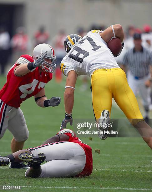 Iowa tight end Scott Chandler is tackled Ohio State Linebacker, A.J. Hawk, during their game, September 24 in Columbus, Ohio. The Buckeyes beat the...