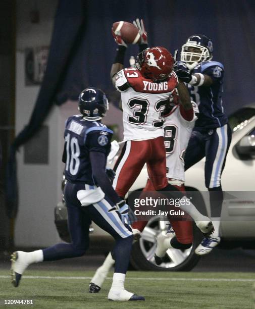 Calgary Stampeders safety Trey Young intercepts this pass in the end zone intended for Toronto's Bashir Levingston in CFL action at Rogers Centre in...