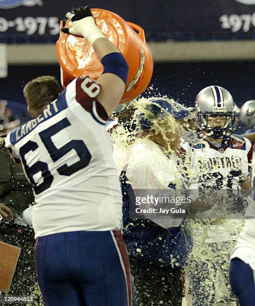 Montreal Head Coach Don Matthews is showered with Gatorade by Offensive Lineman Paul Lambert to celebrate Montreal's 33-17 victory in the CFL East...