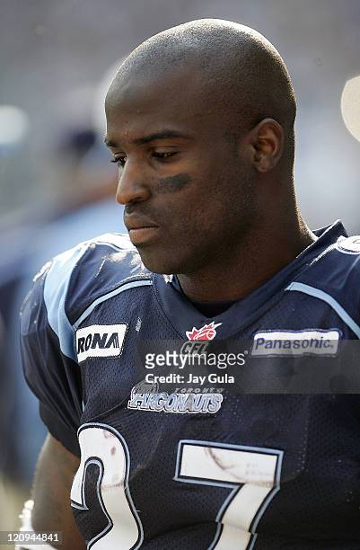Ricky Williams of the Toronto Argonauts on the sidelines and in action vs the Winnipeg Blue Bombers in a Canadian Football League game at Rogers...