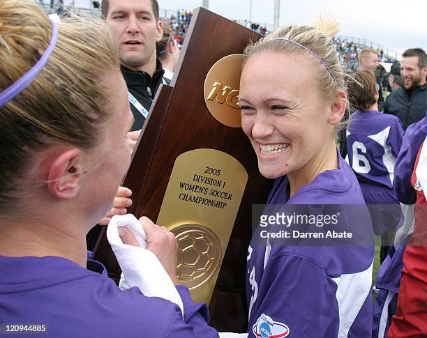 Portland's Colleen Salisbury celebrates the win with the championship trophy after the 2005 NCAA Women's College Cup championship game between the...
