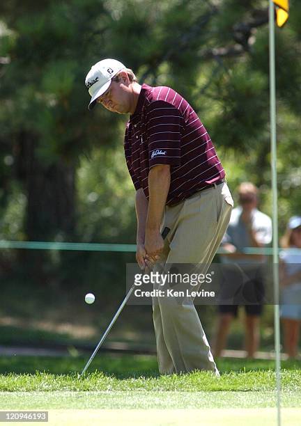 Davis Love III hits a pitch shot on the 7th hole during the final round of the International Golf Tournament at Castle Pines at Castle Pines,...