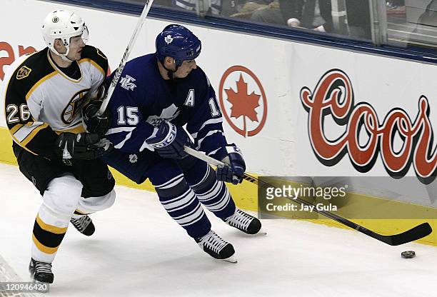Toronto Maple Leafs Tomas Kaberle fends off Boston's Brad Boyes during game between the Toronto Maple Leafs and Boston Bruins at the Air Canada...