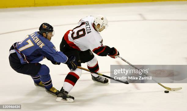 Atlanta Thrashers forward Ilya Kovalchuk harasses Ottawa center Jason Spezza during the game between the Atlanta Thrashers and the Ottawa Senators at...