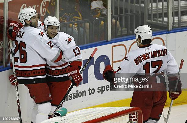 Carolina Hurricanes winger Ray Whitney celebrates the first goal of the game with Erik Cole and Rod Brind'Amour during the game between the Atlanta...