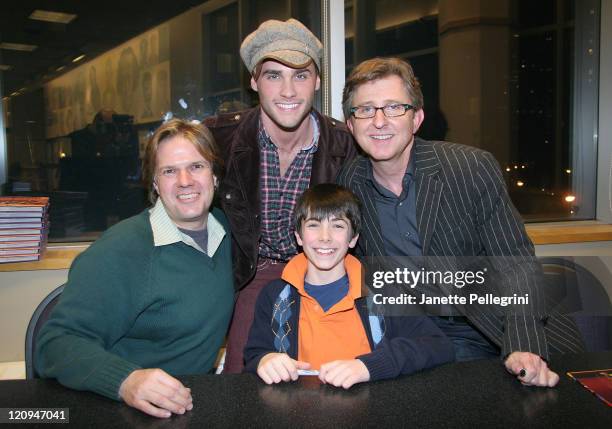 Authors Jeff Kurtti, left, and Thomas Schumacher, right, attend the signing of their new book "How Does the Show Go On?" with actor Josh Strickland,...