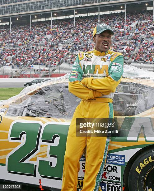 Driver Bill Lester poses with his car before the Golden Corral 500 NASCAR race at Atlanta Motor Speedway in Hampton, Georgia, March 19, 2006.
