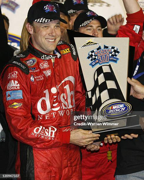 Matt Kenseth holding the winners trophy after winning the Stater Brothers 300 NASCAR BUSCH SERIES being run at California Speedway, Fontana, Ca. Feb...