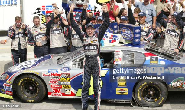 Kyle Busch, and his No.5 Lowes Chevrolet Monte Carlo, celebrates his victory in the Carquest Auto Parts 300 at Lowe's Motor Speedway, in Concord,...