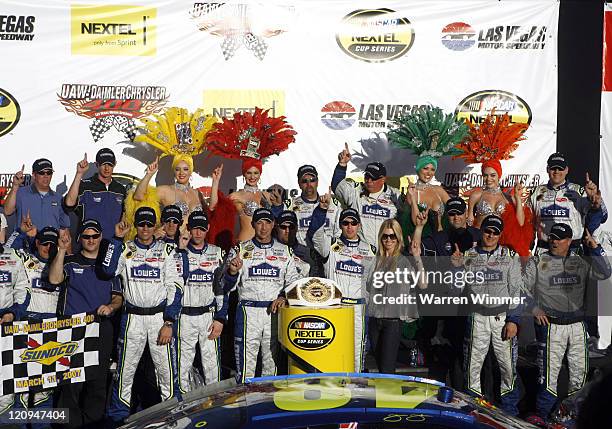 Jimmie Johnson winner of todays race, celebrates in Victory Lane with his crew during the UAW -DaimlerChrysler 400 at the Las Vegas Motor Speedway in...