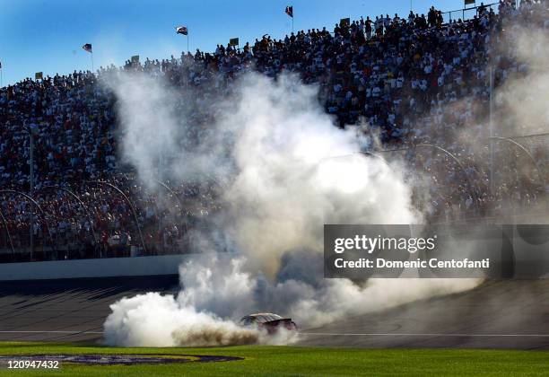 Jeremy Mayfield does a burnout at Michigan International Speedway in Brooklyn, Michigan after winning the Nextel Cup Series GFS Marketplace 400 on...