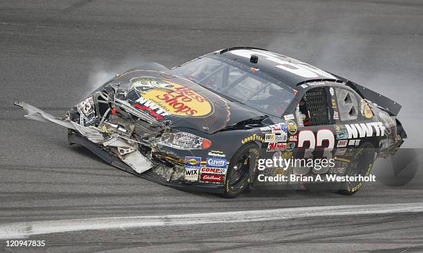 Kerry Earnhardt's Bass Pro Shops Chevy shows heavy front end damage after a multi-car pile-up at the start of the NexTel Open at Lowe's Motor...